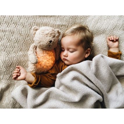 Moonie - Snuggle buddy melodialla ja valolla pieni karhu organic hunajanauhat natur
