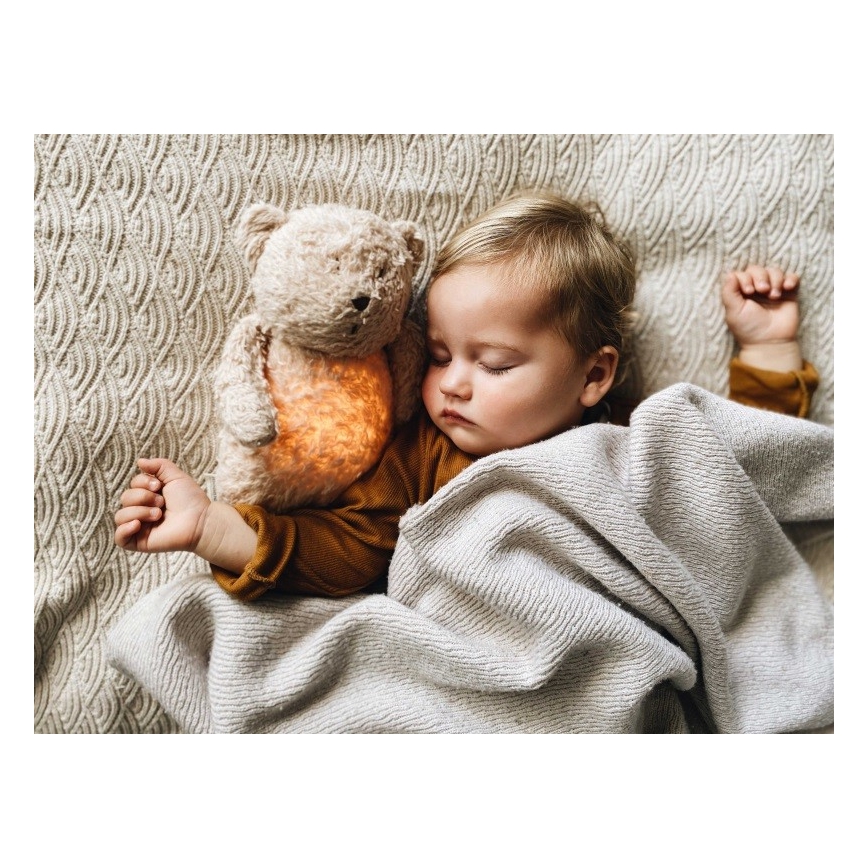 Moonie - Snuggle buddy melodialla ja valolla pieni karhu organic hunajanauhat natur