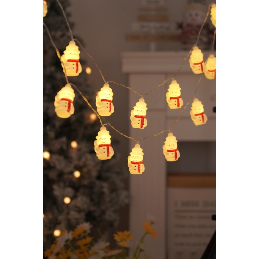 LED-jouluketju 20xLED/3xAA/lämpimänvalkoinen 3,3m lumiukkoja