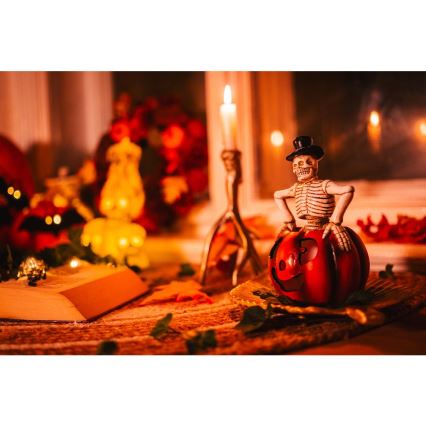 LED Koriste HALLOWEEN LED/2xLR44/lämpimänvalkoinen luuranko kurpitsassa hartsi