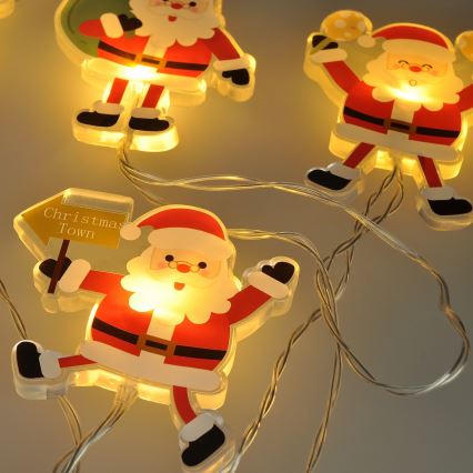 LED jouluketju imukupeilla 6xLED/2xAA 1,2m lämmin valkoinen joulupukki