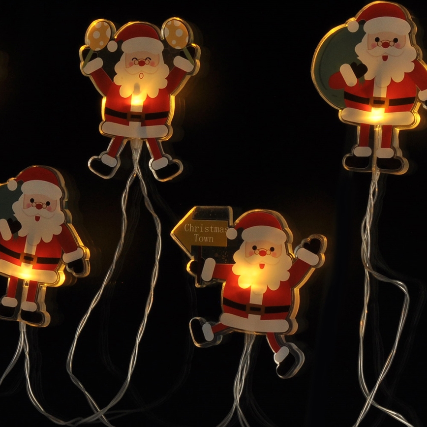 LED jouluketju imukupeilla 6xLED/2xAA 1,2m lämmin valkoinen joulupukki