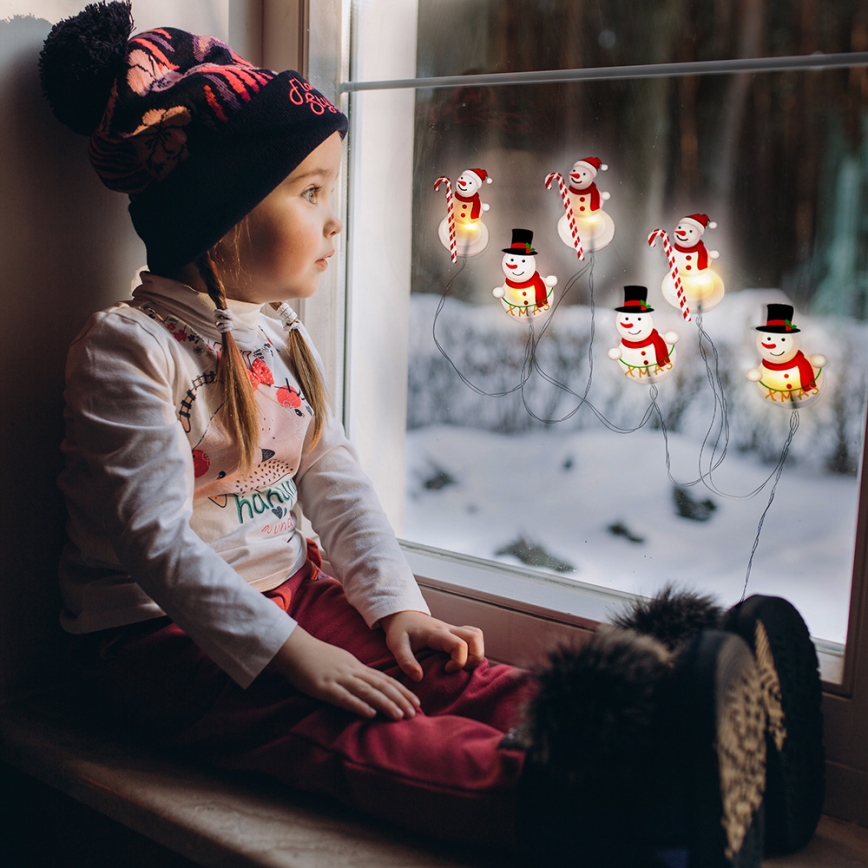 LED jouluketju imukupeilla 6xLED/2xAA 1,2m lämmin valkoinen lumiukko