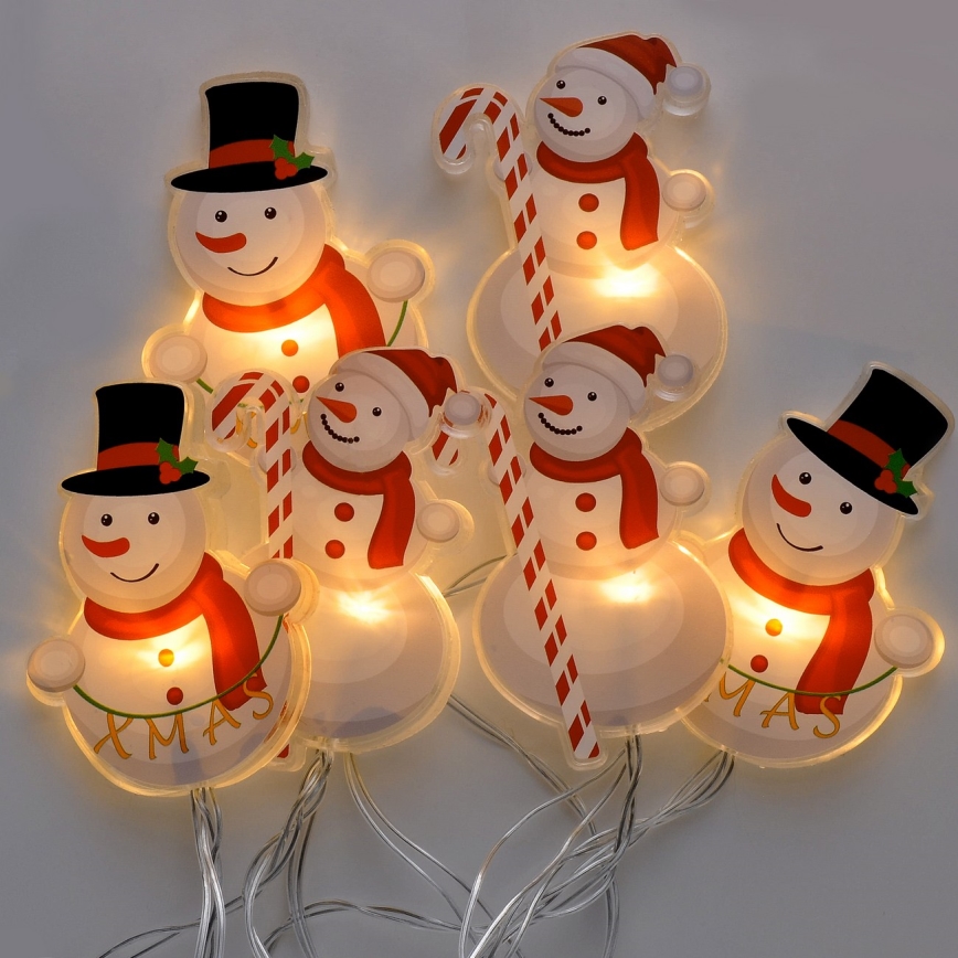 LED jouluketju imukupeilla 6xLED/2xAA 1,2m lämmin valkoinen lumiukko