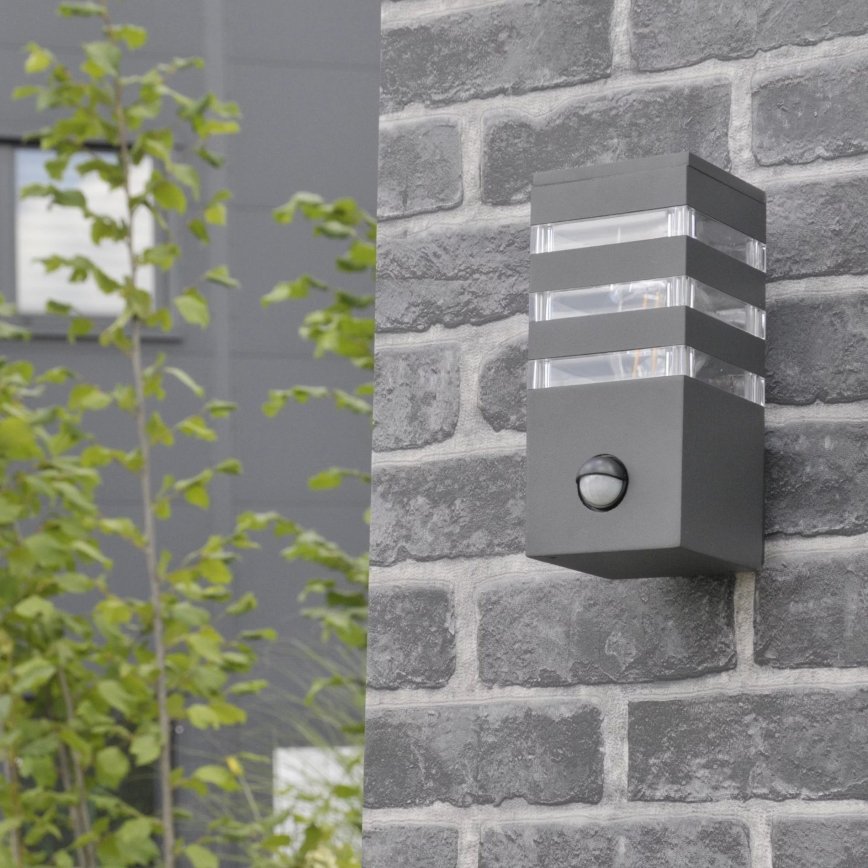 Ulkoseinävalaisin anturilla TEKSAS 1xE27/12W/230V IP44 antrasiitti